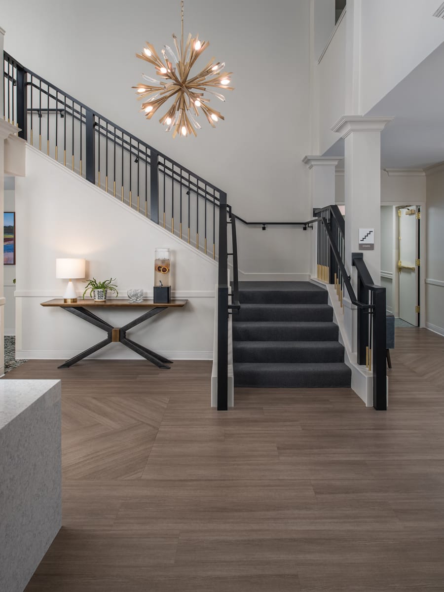 Entry lobby with seating and warm lamp light